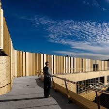 Basque Culinary Center By Vaumm San Sebastian Spain The Golden Facades Are Made Up Of Perforated Metal Panel Spain Design Multi Storey Building Metal Facade