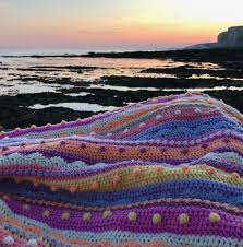 Why not make something bright for your baby? The Late Summer Sunsets Blanket The Knitting Network