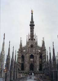 These pinnacles are linked with flying. Dome Of Milan Italy Famous Madonnina Atop The Main Spire A Baroque Gilded Bronze Statue Milan Cathedral Architecture Photo Cathedral Church