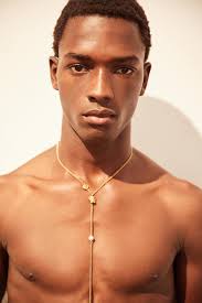 A gold tone body chain