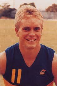 Senior Coach Chris Fagan and the Brisbane Lions' 2024 Premiership team  celebrate their Grand Final win over Sydney Fitzroy