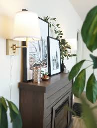 The advantage of this is that the electric fireplace then has its own power connection which is also a safer option. Plug In Sconces My Electric Fireplace Centsational Style