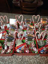 Christmas Baskets For Staff Small Yankee Candles With A Gift Card Hot Glued On Candy Canes Teacher Christmas Gifts Homemade Christmas Gifts Christmas Baskets