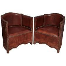 If you can't find the legs when taking the chair out of the box, there's a zippered enclosure under the seat. Superb Pair Of Vintage Moroccan Leather Barrel Chairs At 1stdibs