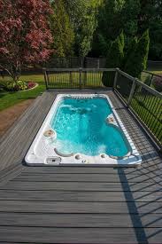 Don T Like The Above Ground Look Surround Your Swim Spa With A Deck Hot Tub Backyard Swim Spa Deck Pool Hot Tub