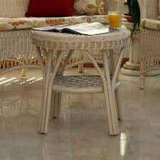 When choosing a coffee table for your conservatory, we recommend looking into furniture that has been made from rattan. Loom Style Conservatory Coffee Table With Shelf Candle And Blue