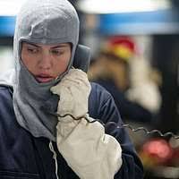 Master-at-Arms 1st Class Travis Alston, right, from Baltimore, communicates  with damage control central during a general quarters drill aboard the  guided-missile destroyer USS Laboon (DDG 58).