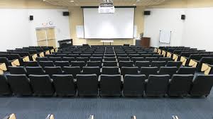 The Mercury Auditorium Chair In Black Fabric And Maple Accents Looks Sleek At Roger Williams University Feinstein Auditorium Chairs Auditorium Seating Seating