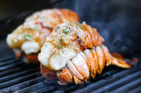 A skewer can also be placed through the center of the halved tails to prevent the seafood from curling. Grilled Lobster Tails With Smoked Paprika Butter Foodiecrush Com
