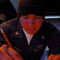 Operations Specialist 1st Class Ryan Saylor mans the