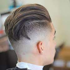 High Undercut Fade With Textured Slicked Back Hair Undercut Hairstyles Mens Hairstyles Undercut Long Hair Styles Men