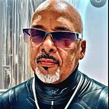 What is the location of the beautiful beach in the Cayman Islands?