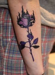 Burning Rose Tattoo Get An Inkget An Ink Tattoos Rose Tattoos Feather Tattoos