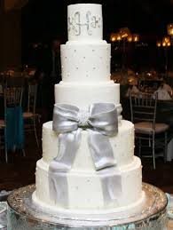 Round White 5 Tier Wedding Cake With Large Silver Bow And Monogram On Top Tier Jpg Winter Wedding Cake Cinderella Wedding Cake Wedding Cake Prices