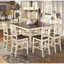 Table features storage cabinet on the bottom. Ashley Whitesburg 9 Piece Counter Height Dining Set In Brown And White Walmart Com Walmart Com