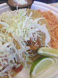 Rice and beans for fish tacos. Two Fish Taco Combo With Refried Beans And Spanish Rice Rubio S Baja Grill S California Spanish Rice Refried Beans Mexican Seafood