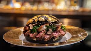 Order food online at gold star hamburger, glendale with tripadvisor: 1 600 Burger Topped With Gold Hits The Menu At H Bar In Houston Tx Robb Report