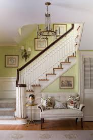 Foyer seating can make all the difference to you entrance. This Home Goes Beyond The Traditional And Incorporates Elements From Around The World Including A Prominent Foyer Furniture Foyer Decorating Staircase Design