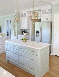 Coastal Kitchen Island Oyster Bay Deep Drawers For Base Cabinets Counter Tops Are Cambria Quartz Which We Had Kitchen Remodel Coastal Kitchen Home Kitchens