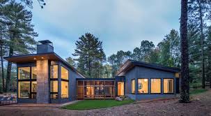 This stacked, modern lake house gives plenty of storage space for all of your water sport and boating this cabin features stone accents and clean lines to give a rustic vibe without going too log. Modern Lake House Getaway On Forested Landscape In Northern Minnesota