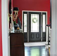 Love The Way They Painted The Door And Sidelights Black And The Trim On Here White Black Interior Doors Painted Front Doors Red Walls