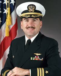 Commander Frank E. Pagano, USN (covered)