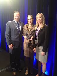 Massachusetts Life Sciences Center President Susan Windham-Bannister  accepts MassBio's Leading Impact Award