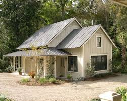 Now offering financing as low as $79.00 per month with 0% down! Charcoal Metal Roof Light Grey Taupe House Color Wood Door Metal Roof Houses Cottage House Exterior Metal Building Homes