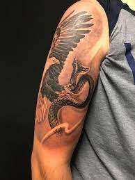 16 Realistic Eagle And Snake Tattoo Designs With Meanings Petpress Eagle And Snake Tattoo Tattoo Designs And Meanings Snake Tattoo Designs
