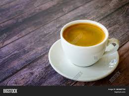 The original coffee table, typically, is a normal table with shorter legs to make the table lower they include such contemporary designs as an aquarium style coffee table or even a foosball coffee table. Hot Coffee Americano Image Photo Free Trial Bigstock