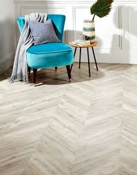 My partner and i are planning to lay new laminate flooring over an old asbestos tiled living room floor. Chevron Natural Oak Laminate Flooring Direct Wood Flooring