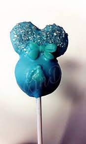 Blue Baby Shower Cake Pop Pregnant Woman Belly Baby Foot Showing Covered In Chocolate With Sprin Blue Baby Shower Cake Baby Shower Cake Pops Baby Shower Cakes