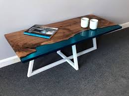 Artist rivka wilkins and woodworker jared davis have collaborated on a series of beautiful coffee tables that capture ocean waves crashing on the shores of a live edge walnut coffee table. Shoreline Coffee Table Evokes Sublime Imagery Of Ocean Reaching Land