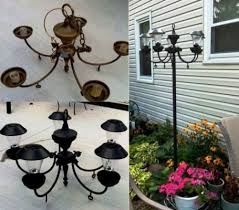 Bought An Old Light Fixture For 5 00 Painted It Black Replaced The Bulbs With Solar Lights And Then I Was Going To Hang It Old Lights Garden Art Solar Lights