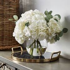 Large White Hydrangea Eucalyptus Arrangement In Rounded Glass Vase In 2020 Table Flower Arrangements Dining Room Table Centerpieces Dining Room Centerpiece