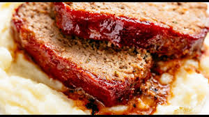 Check the meatloaf's temperature while it is still in the oven by inserting the thermometer into the center of the loaf. Meatloaf Cafe Delites