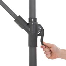 A solar cell on top of the umbrella charges throughout the day. Corliving 9 5ft Lime Green Uv Resistant Offset Tilting Fabric Patio Umbrella Ppu 440 U