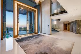 Idée de décoration pour une très grand façade de maison grise minimaliste à trois étages et plus avec un toit plat et un toit mixte. Apparently Dan Bilzerian Didn T Make Ridiculous Real Estate Facebook