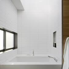 It features a smooth glazed finish with a silk sheen to. Stacked 4x16 White Subway Tiles Design Ideas Pictures Remodel And Decor Modern Bathroom Bathroom Design Stacked Tile