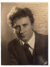 A large vintage portrait photograph of Australian-born musician and  composer Percy Grainger, signed by him with a warm inscription and musical  sentiment