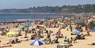 Disposal bins are seen filled with litter after a. Coronavirus Crowds Pack Bournemouth S Beaches Bournemouth Echo