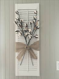 Only if selecting a vintage shutters decorating was so easy. Painted Shutter With Cotton Stems And Burlap Bow Diy Shutters Shutter Decor Painting Shutters