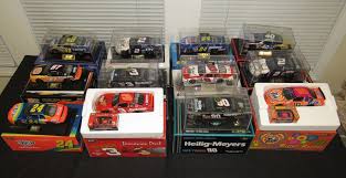 This is a nascar california thunder 500 inaugural race june 22nd 1997 #97 pontiac grand prix in red & yellow 1:24 scale diecast with opening hood from revell 1996. Absolute Auction Realty