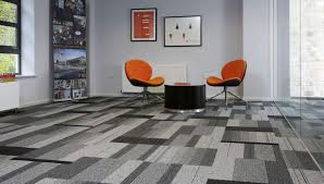 This wood subfloor is being flattened with a feather finish product. The Benefits Of Carpet Tiles Carpet Land Omaha Lincoln Sioux Falls
