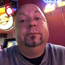 Adahy's mug shot in a proud pose