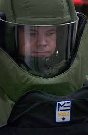 Explosive Ordnance Disposal (EOD) team member Aviation Ordnanceman 1st  Class Brandon Smith wears a bomb suit while testing each of its components  for proper functioning during a training session.