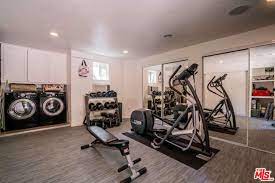 The Idea Of A Combo Laundry Exercise Room Is Positively Brilliant Workout Room Home Basement Laundry Room Workout Rooms