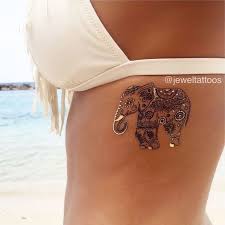 60 Best Elephant Tattoos Meanings Ideas And Designs Metal Tattoo Jewelry Tattoo Tattoos