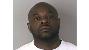 Man charged in double slaying outside convenience store