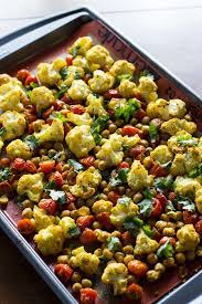 Roasted Cauliflower Tomatoes Chickpeas W Indian Spices Recipe Veggie Dishes Indian Food Recipes Healthy Holiday Side Dishes